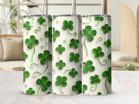 Three tall tumblers adorned with a repeating pattern of green shamrocks.