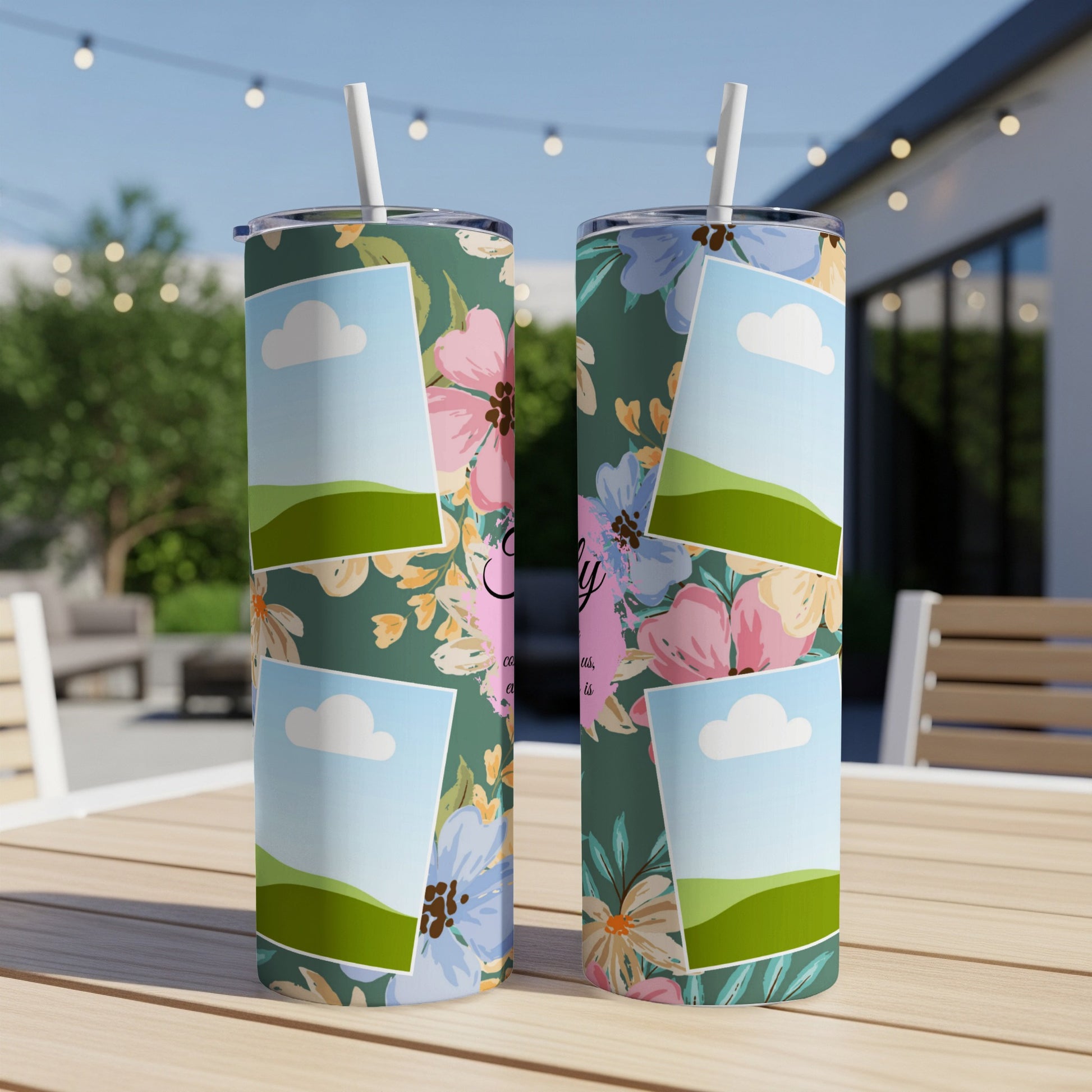 Two tumblers with floral design and photo frames with sky and hills.