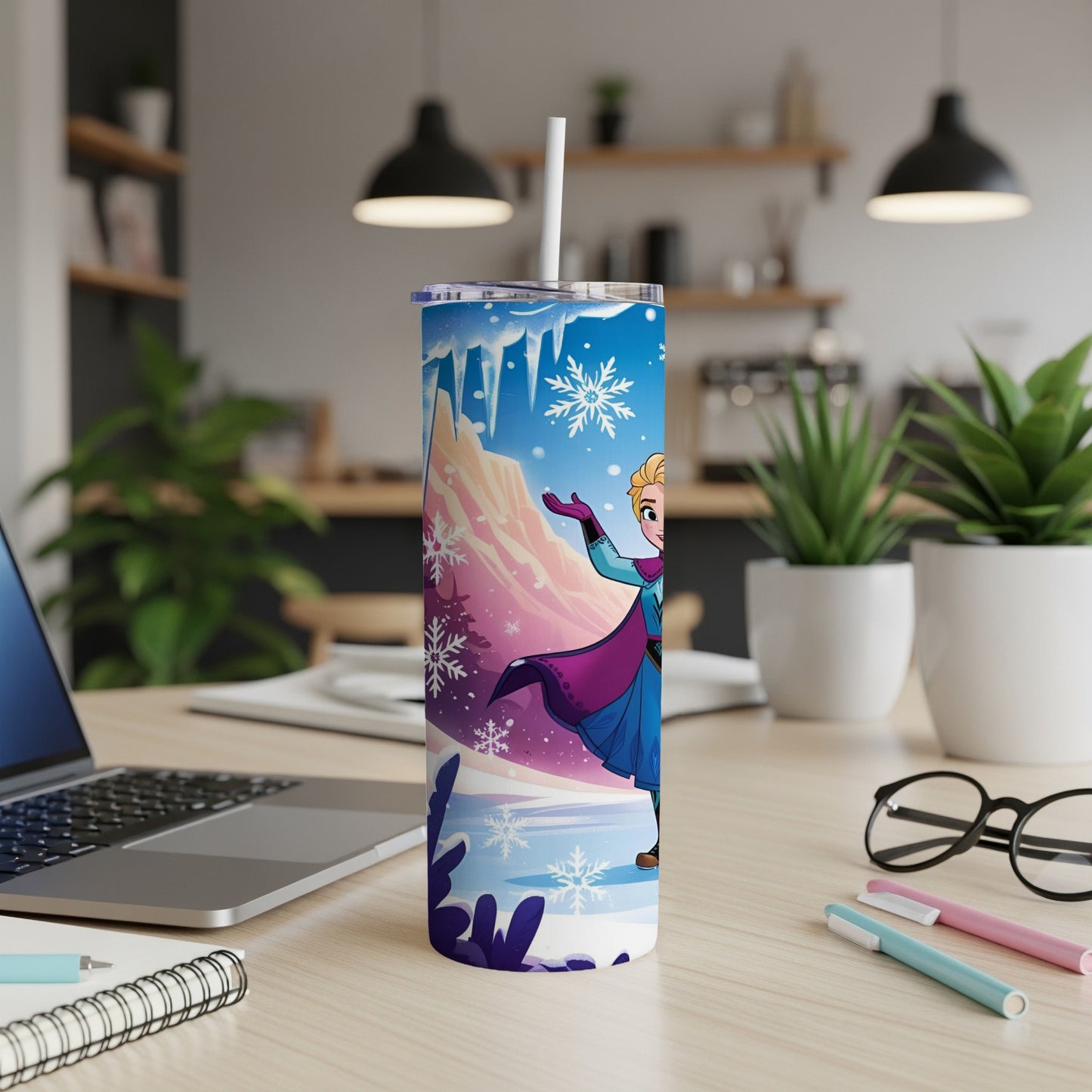 Elsa from Frozen on a tumbler with snowflakes and a winter landscape.