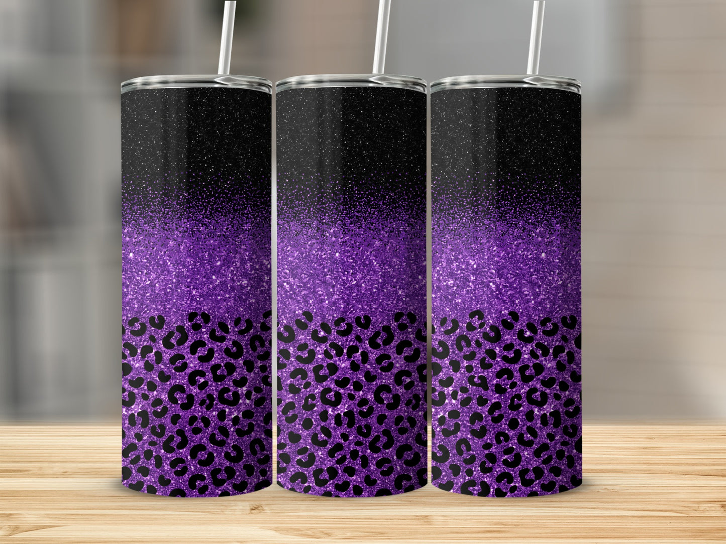 Three tumblers with purple glitter and black leopard print.