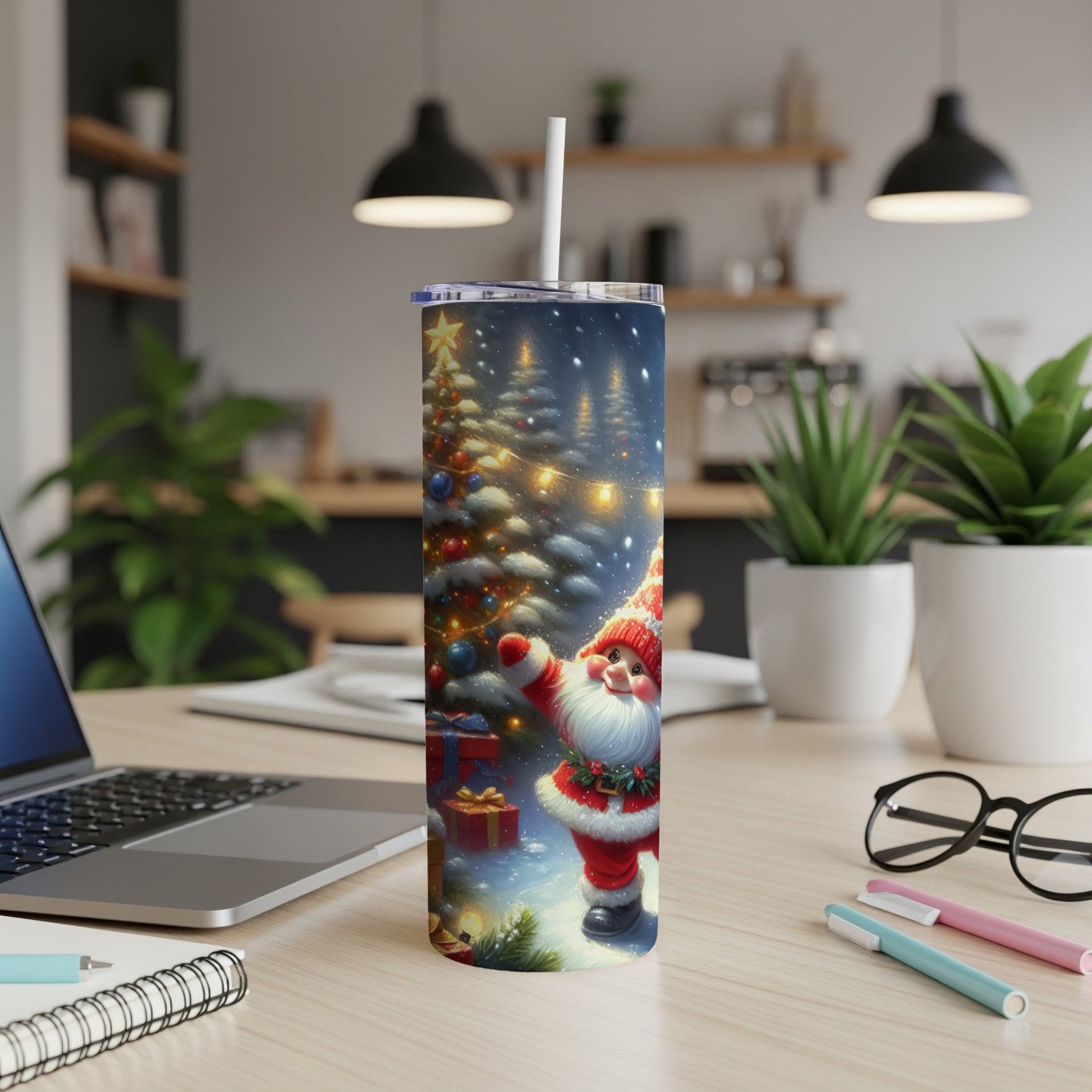 Santa Claus and Christmas tree graphic on a white tumbler with a straw.