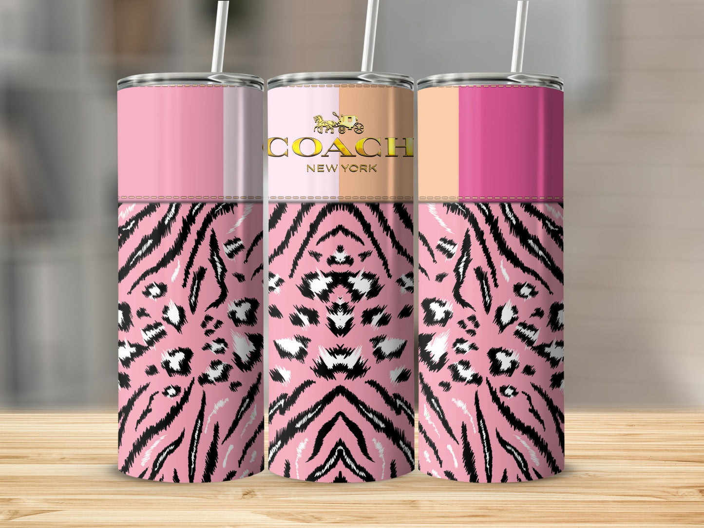 Three pink tumblers with tiger and leopard print, one with Coach New York logo.