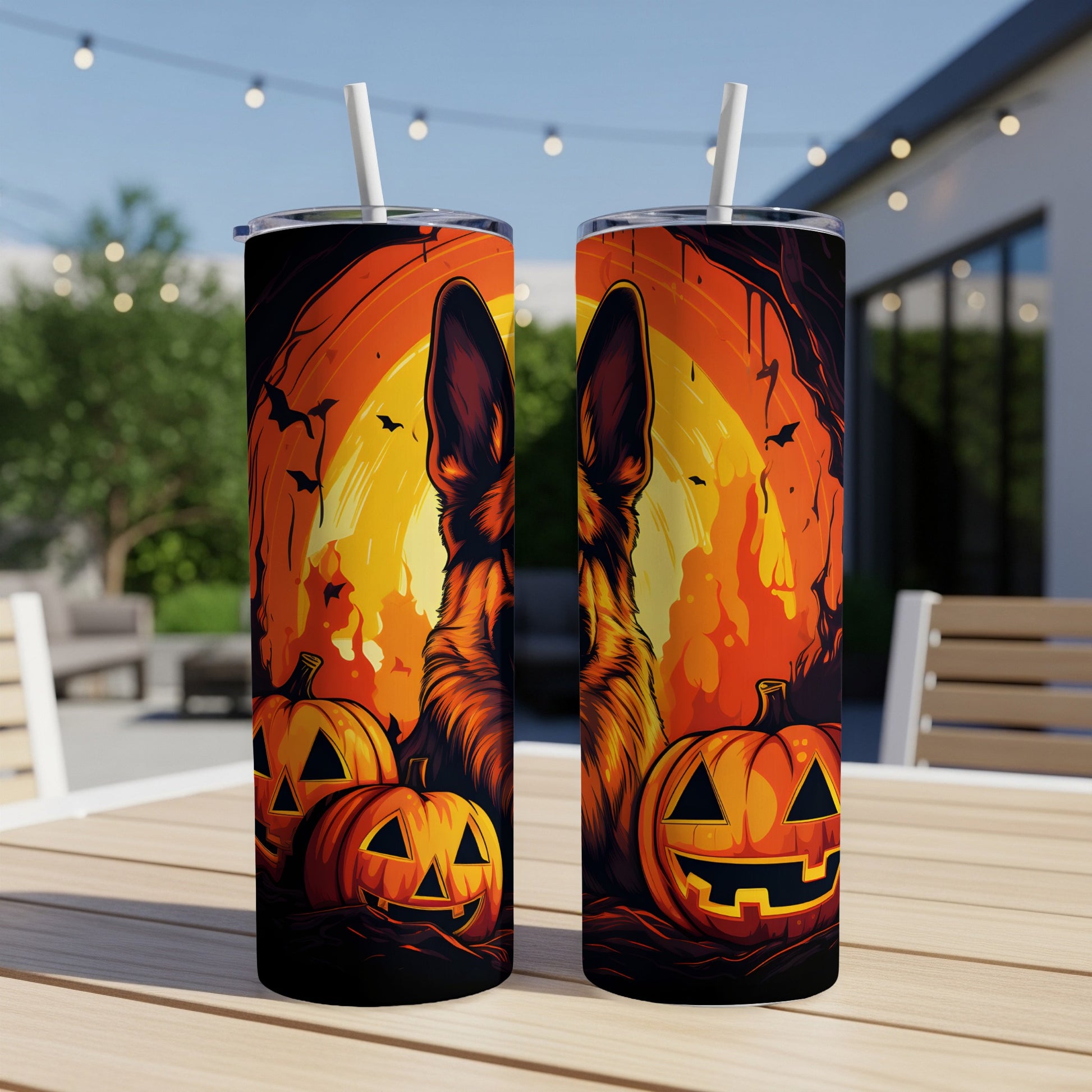 German Shepherd with pumpkins and bats on a Halloween-themed tumbler.