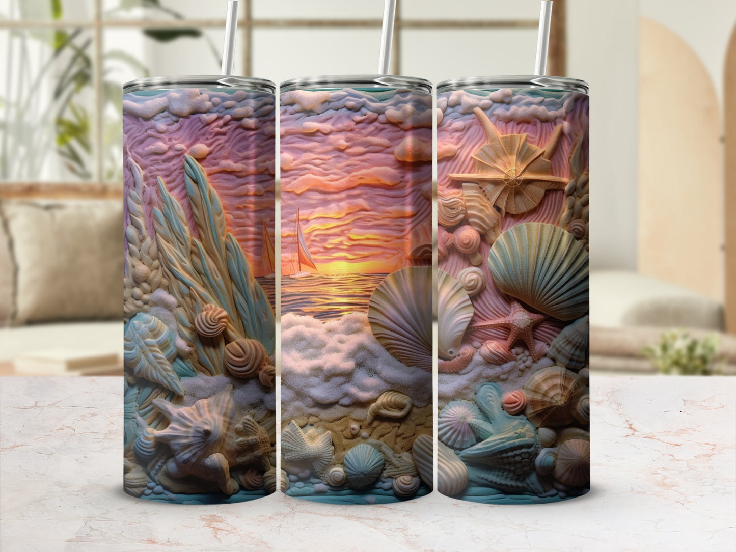 Three tumblers with embossed seashell and beach sunset designs.
