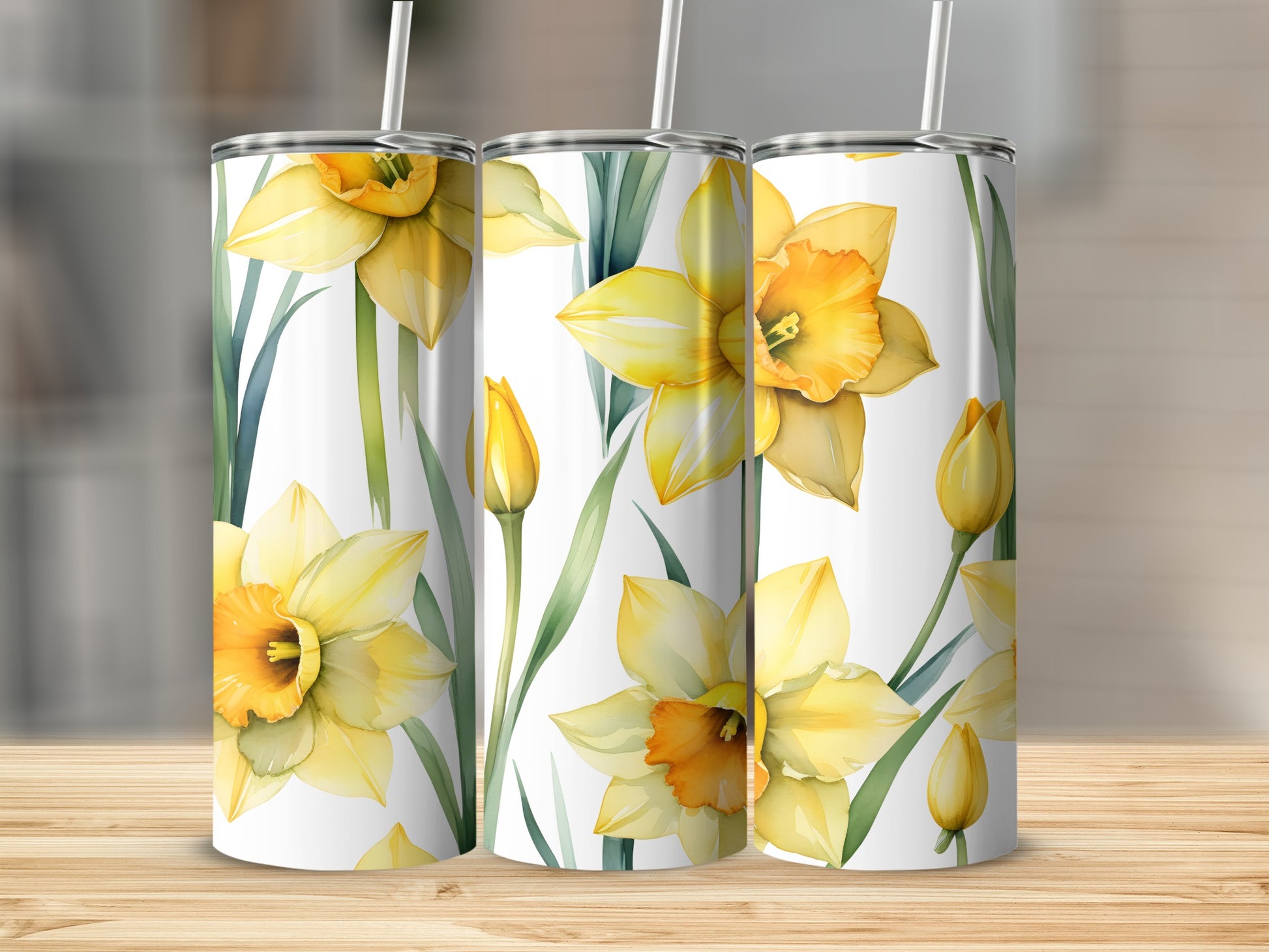 Three tumblers with a watercolor daffodil floral design.