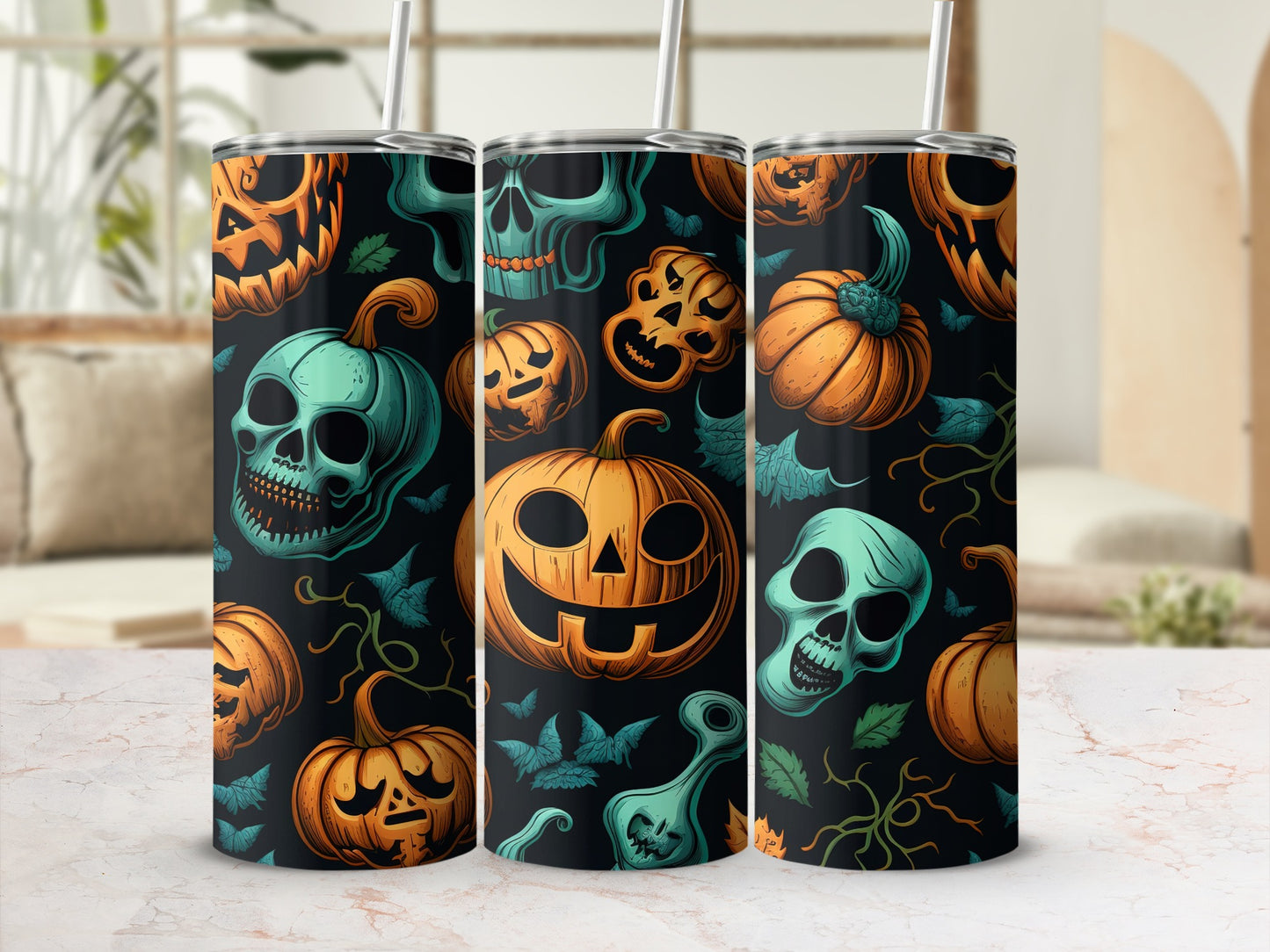 Three tumblers with a Halloween pattern of jack-o'-lanterns and teal skulls.