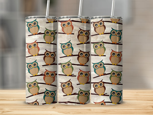 Three tumblers with a repeating pattern of cartoon owls on branches.