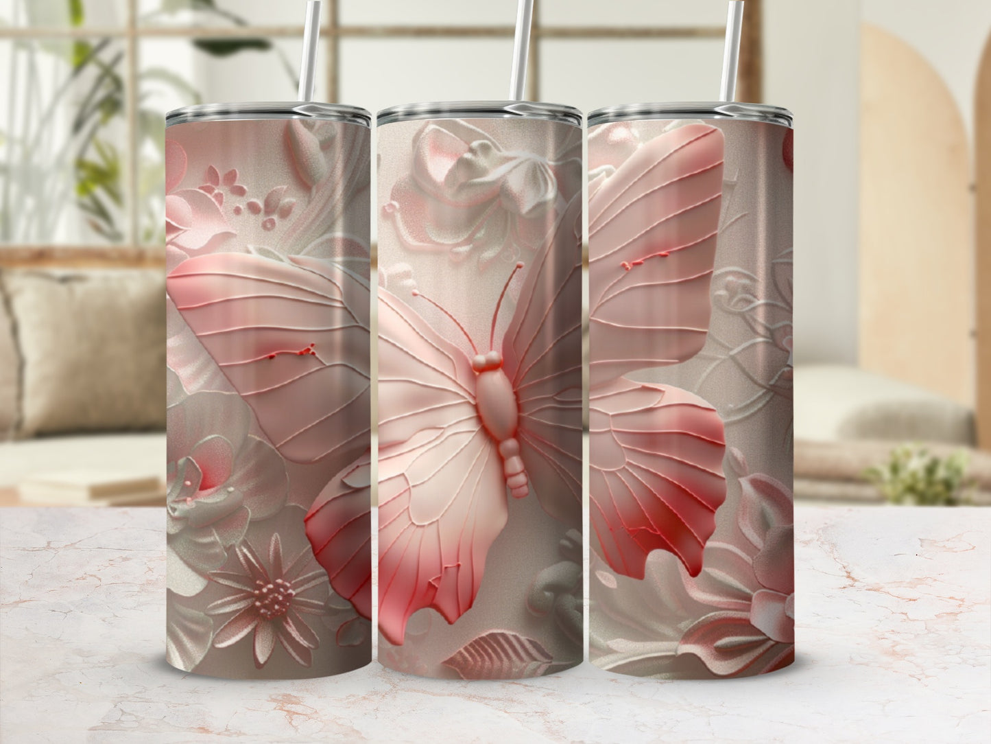 Pink butterfly and floral embossed tumbler with straw.