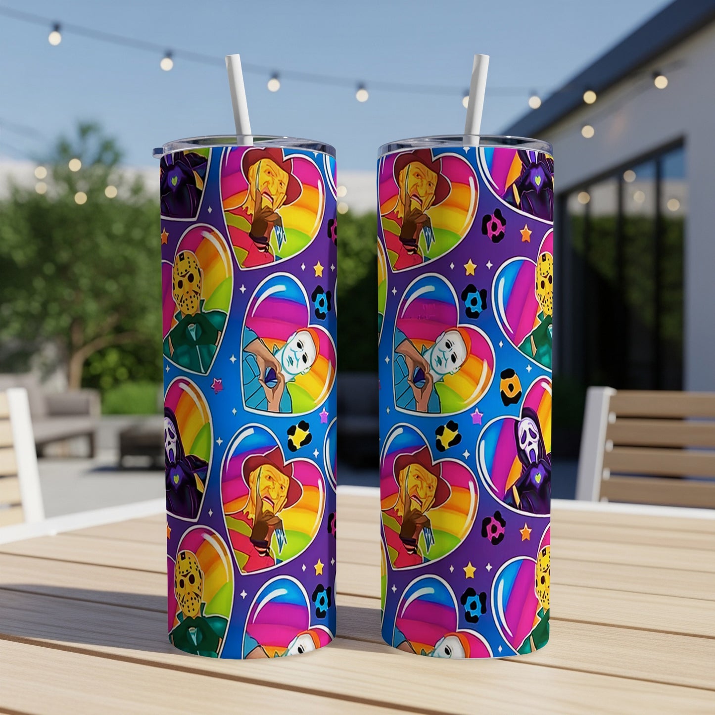 Two tumblers with a repeating pattern of horror movie characters in rainbow hearts.
