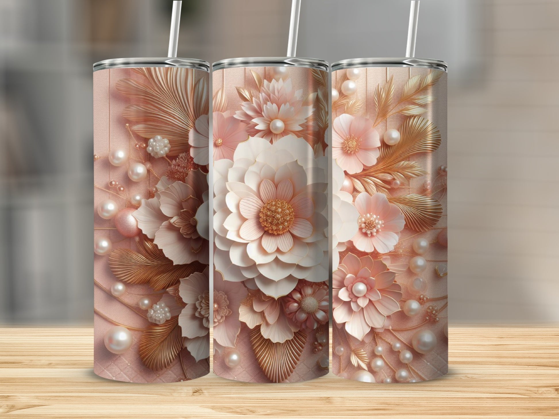 Three tumblers with floral and pearl designs in soft pink and gold tones.