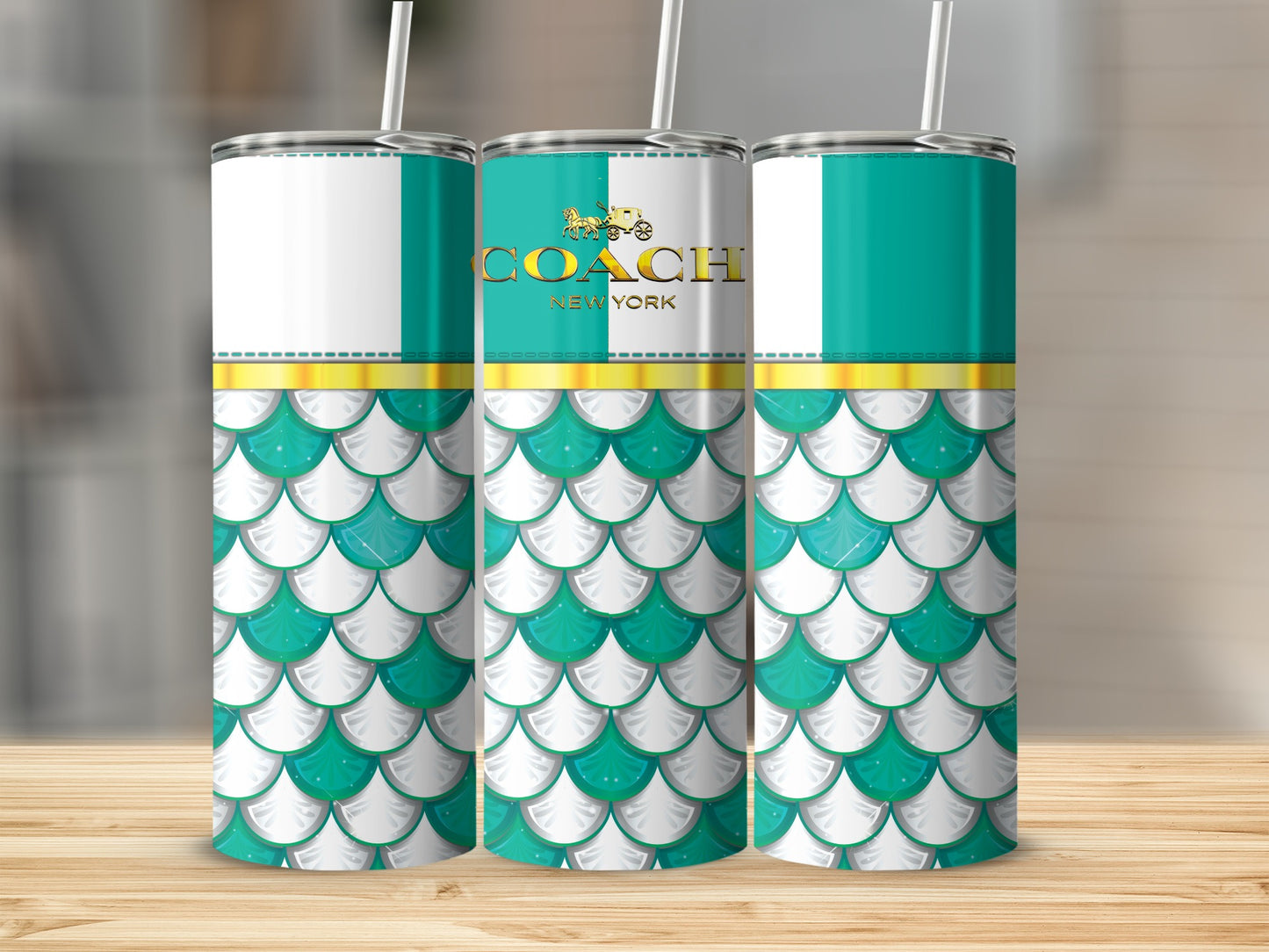 Coach New York tumbler with teal and white scale pattern and gold trim.