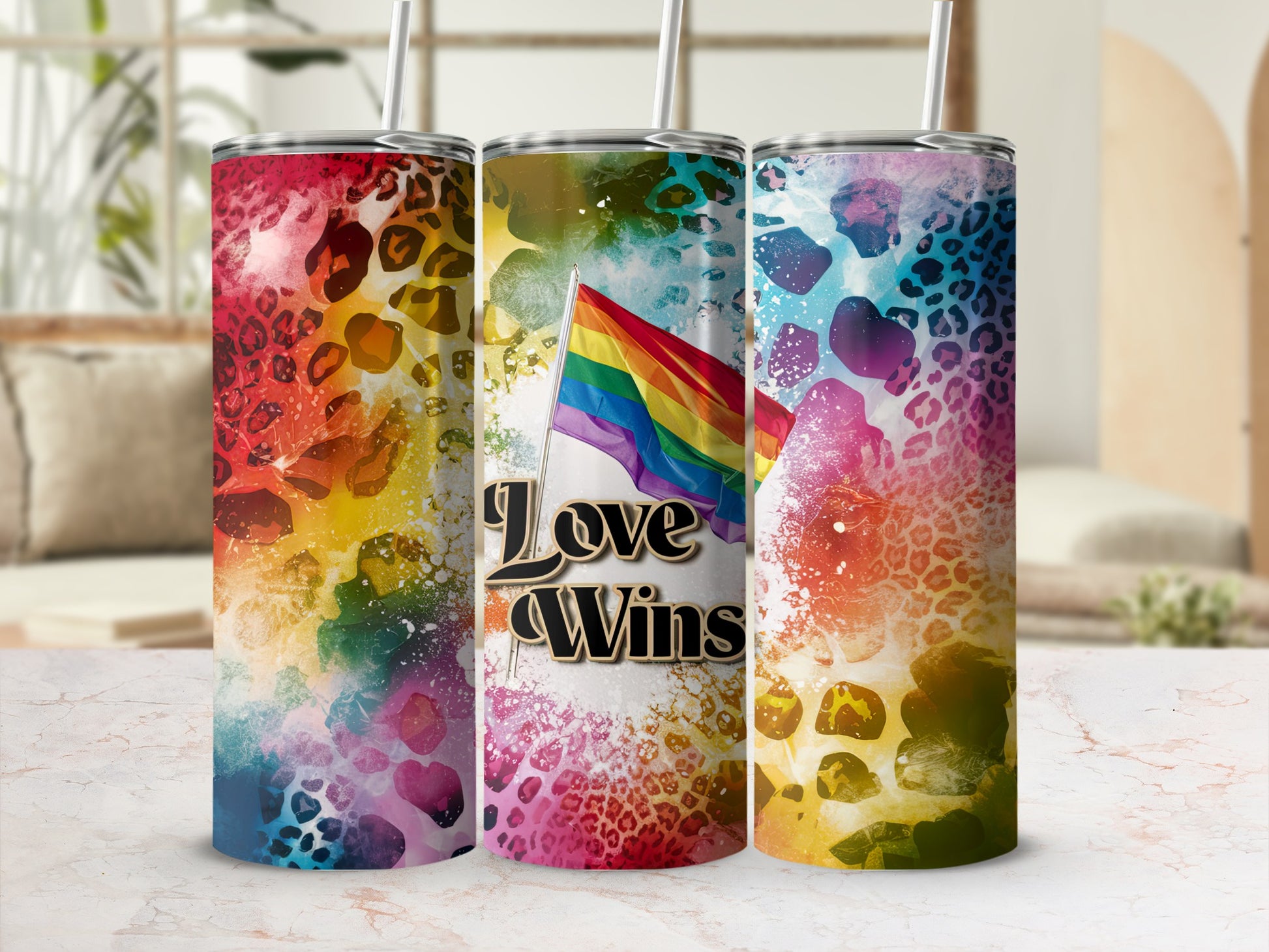 Rainbow flag with "Love Wins" text on a colorful leopard print tumbler.