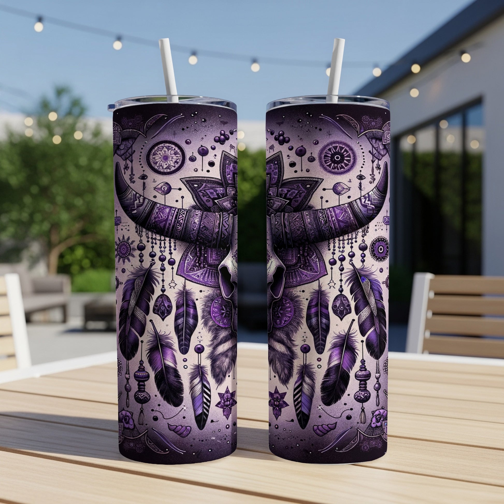 Two purple tumblers with a tribal skull and feather design.