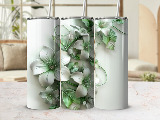 Three white tumblers with embossed green and white floral designs.