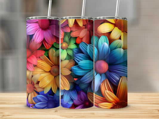 Three colorful tumblers with vibrant floral designs.