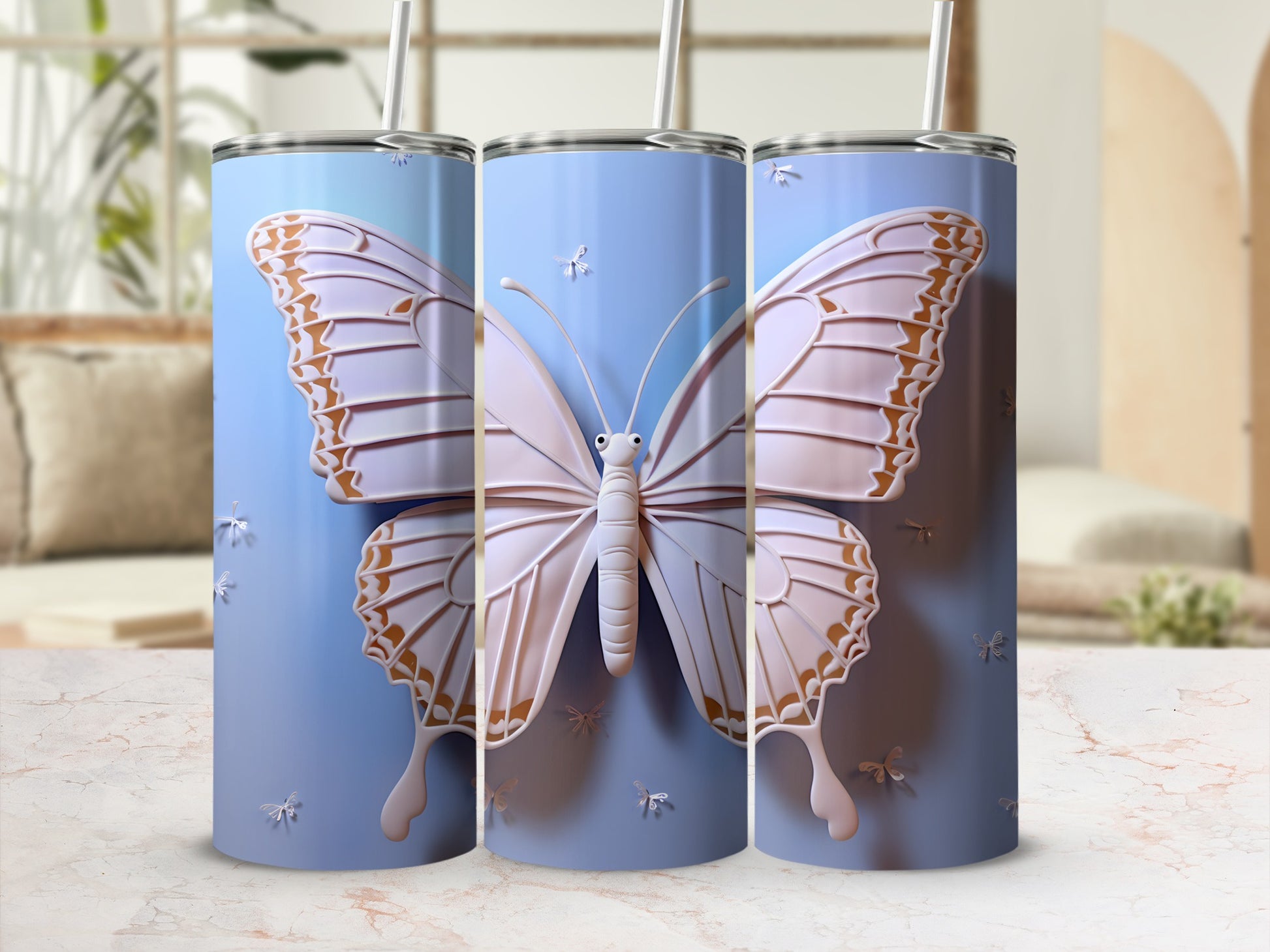 Three blue tumblers featuring a large white butterfly design with pearl accents.