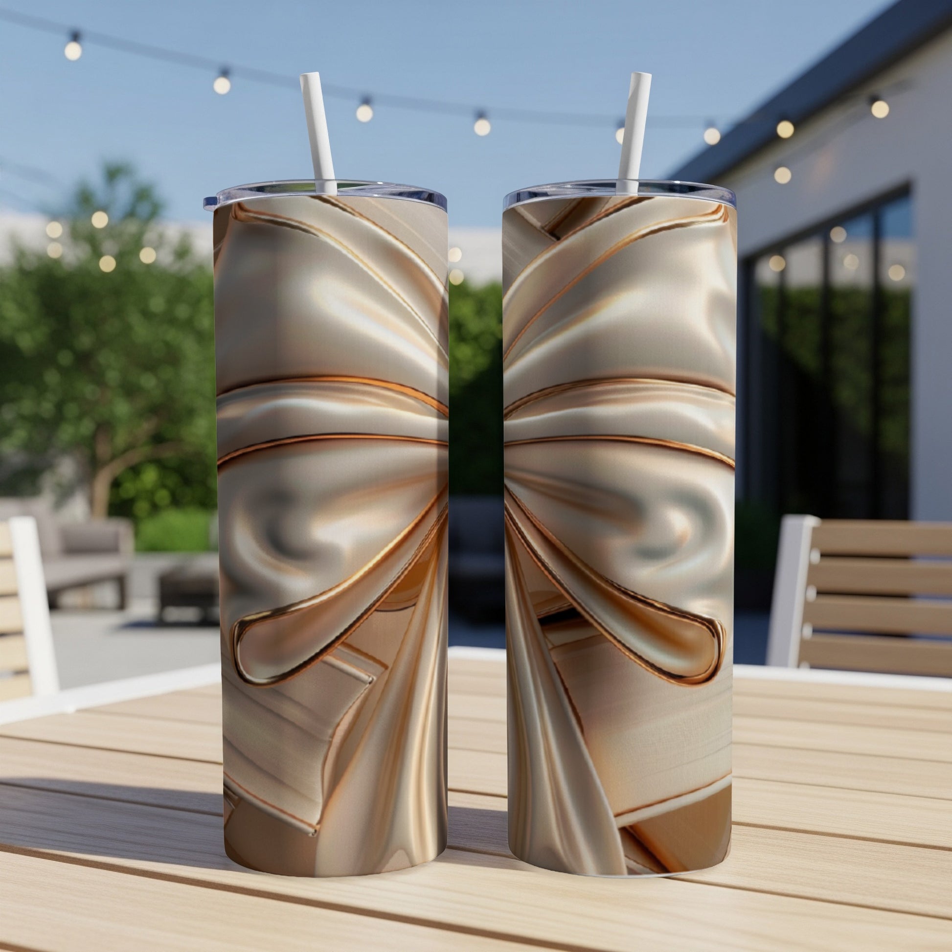 Two metallic gold tumblers with textured wrapping on a wooden table.