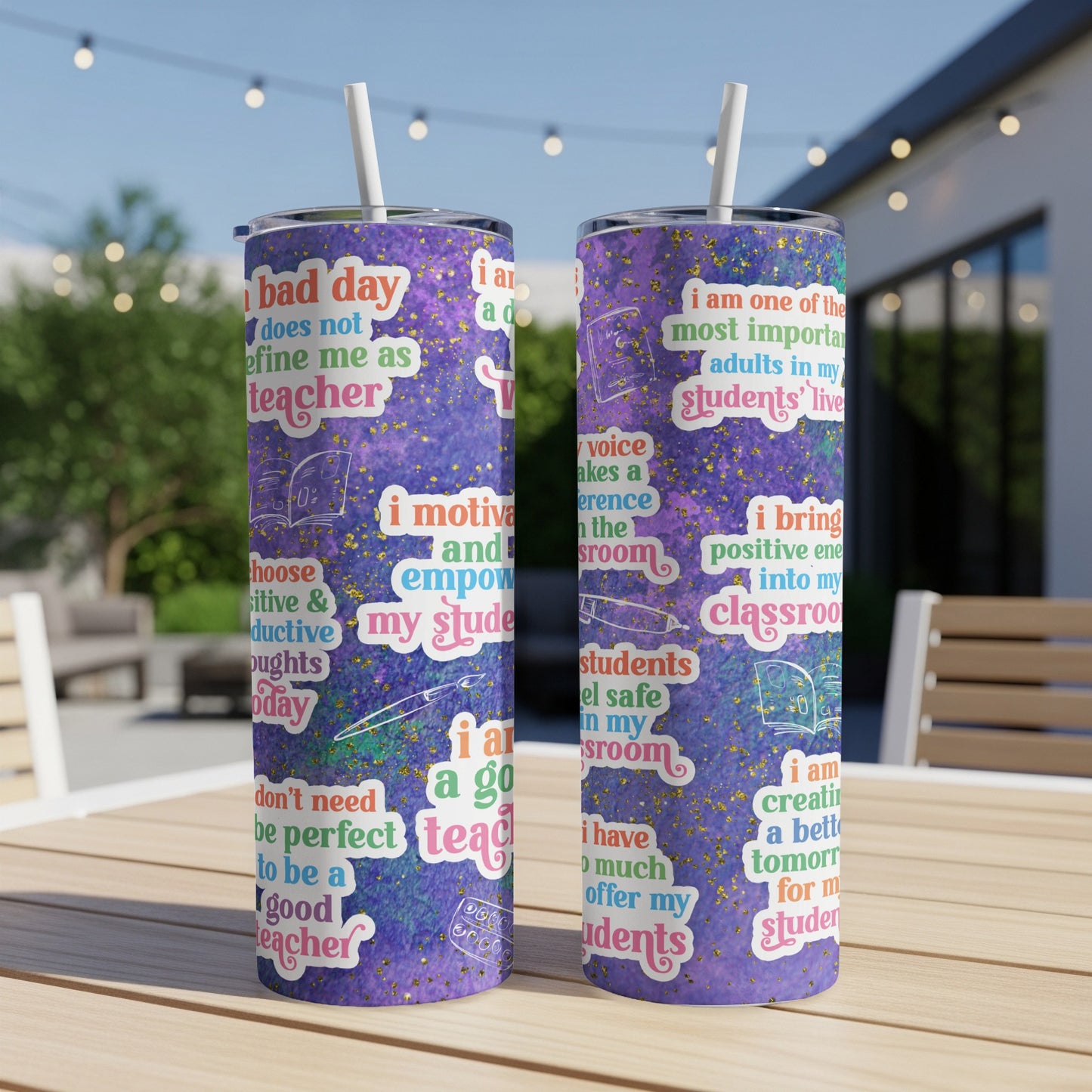 Two tumblers with motivational teacher quotes and doodles against a blurred outdoor background.