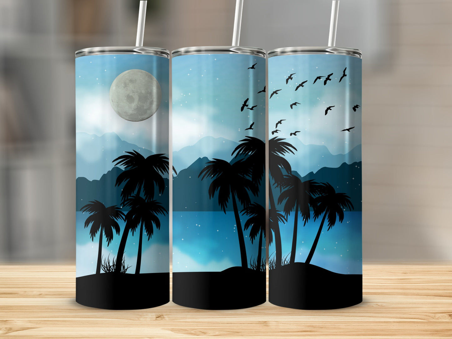 Three tumblers with a nighttime palm tree and moon silhouette scene.