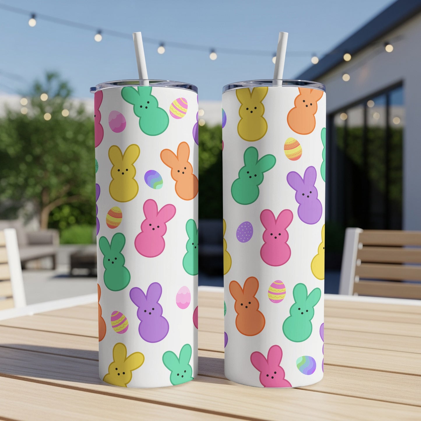 White tumblers with colorful Peeps bunnies and Easter eggs pattern.