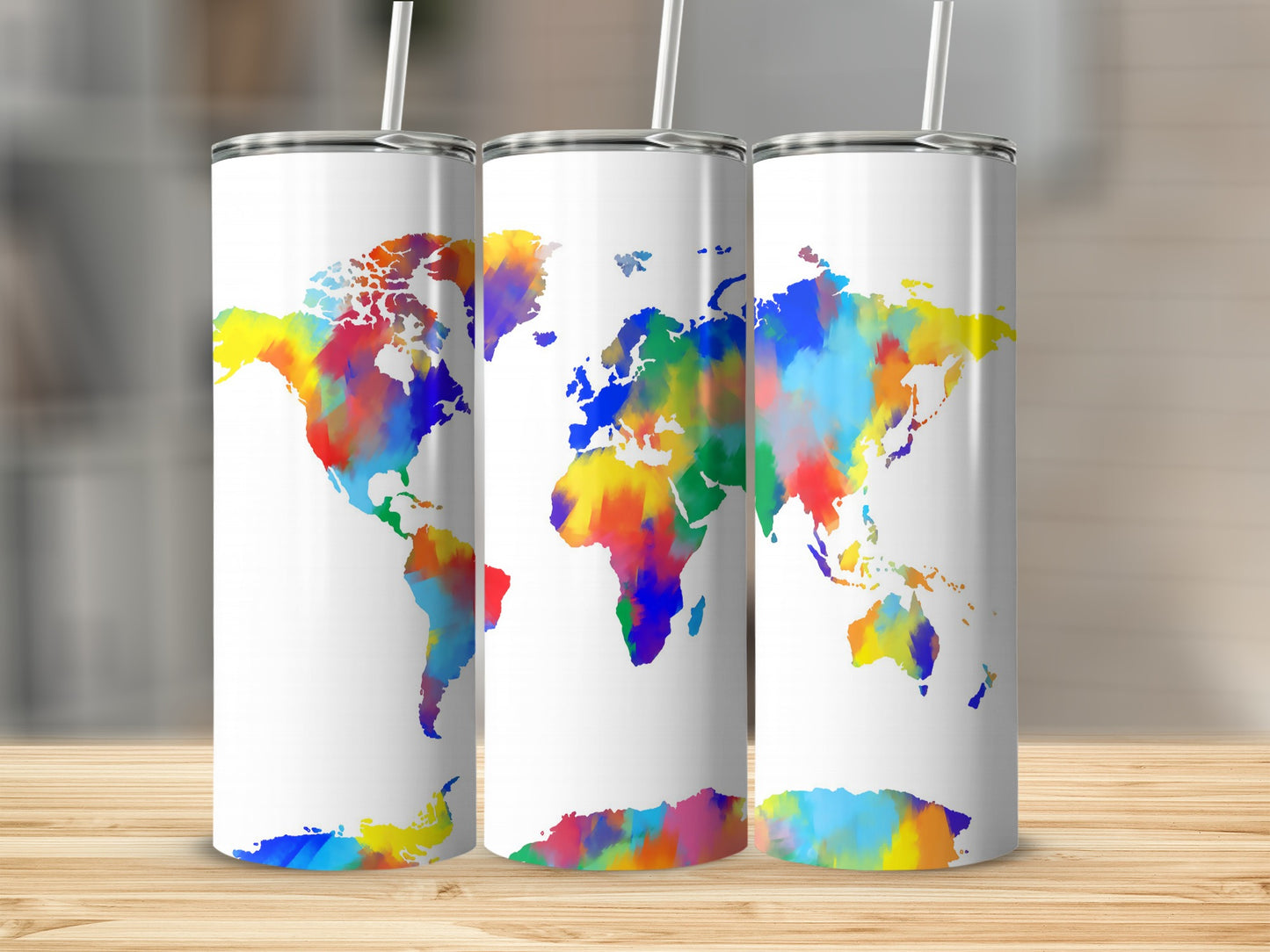 Three white tumblers featuring a colorful, watercolor world map design.