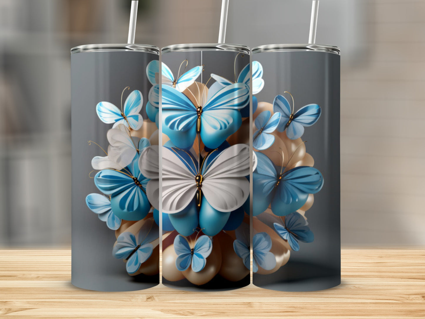 Two tumblers with a butterfly and floral design on a wooden surface.