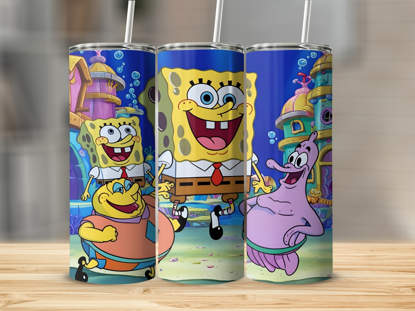 SpongeBob SquarePants, Patrick Star, and Squidward Tentacles characters on a blue tumbler.