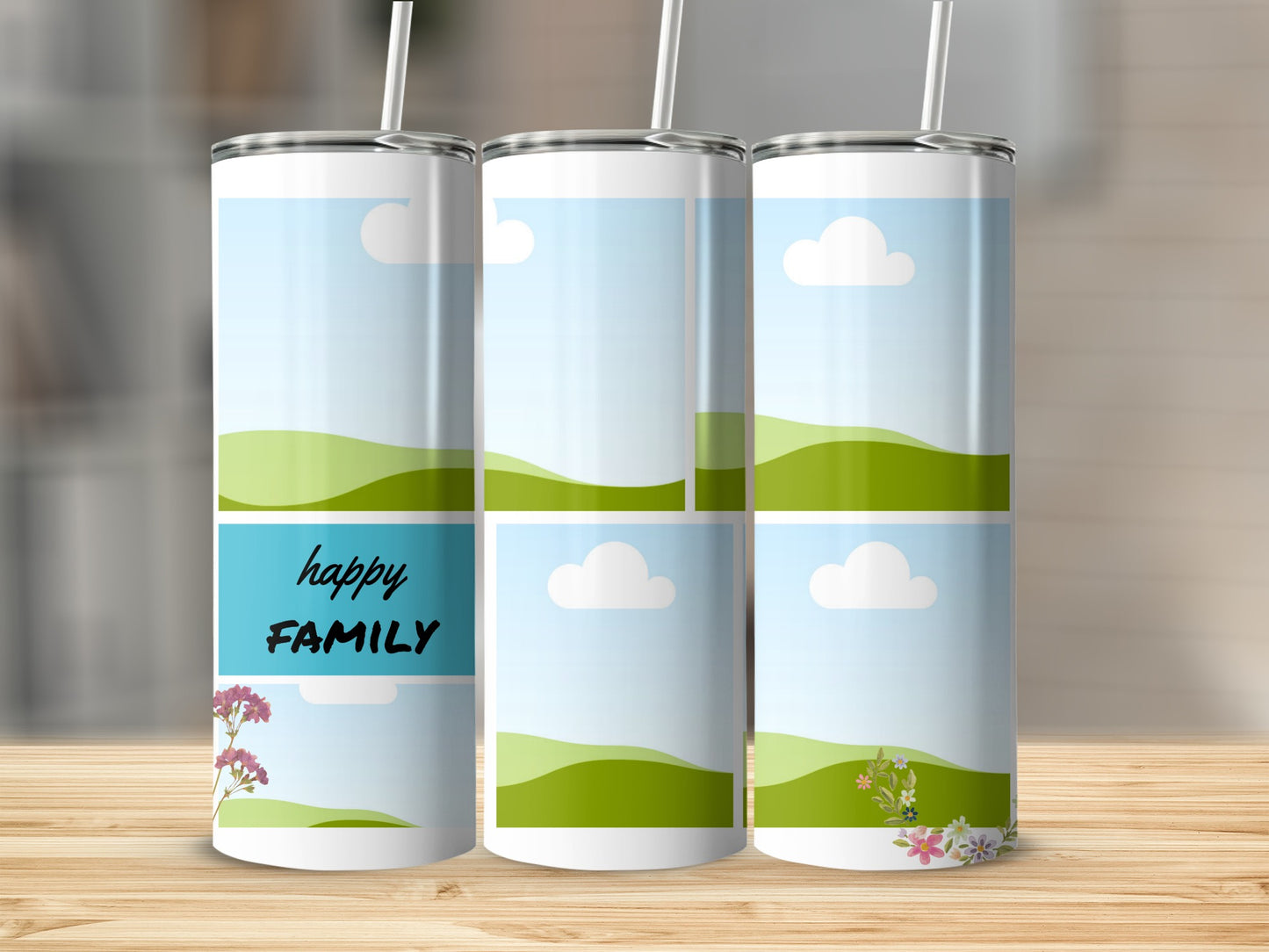 Three tumblers with a "happy FAMILY" design and floral accents on a wooden surface.