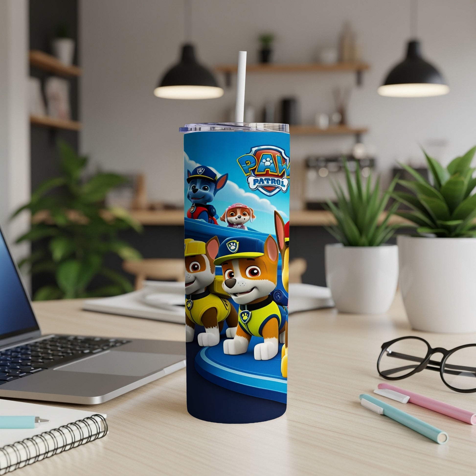Paw Patrol characters Chase, Marshall, and Rubble on a blue tumbler.