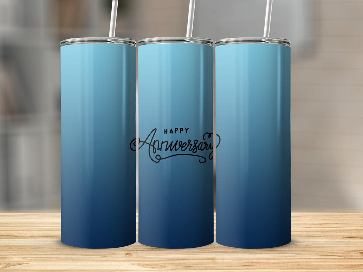 Three blue gradient tumblers with "Happy Anniversary" script on the middle one.