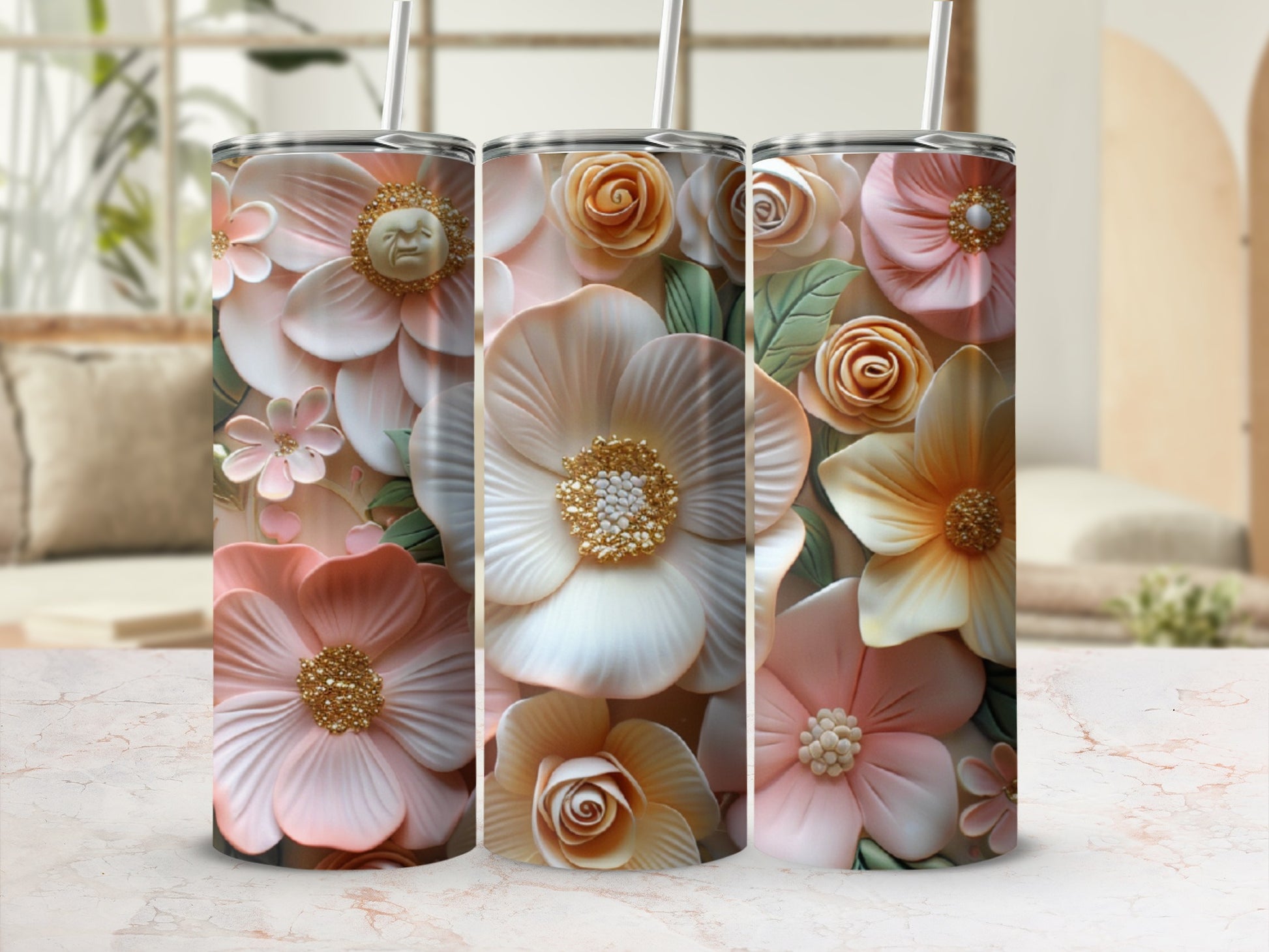 Three tumblers with textured floral designs in pastel pink, cream, and peach.