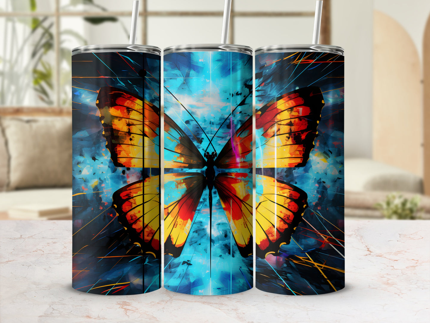 Three tumblers featuring a vibrant butterfly design on a blue, abstract background.
