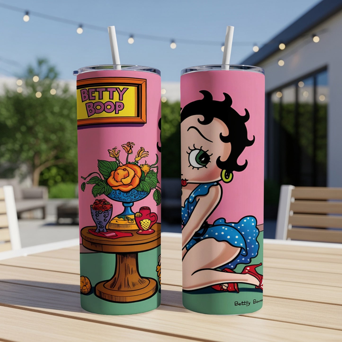Betty Boop tumbler with colorful design and straw.
