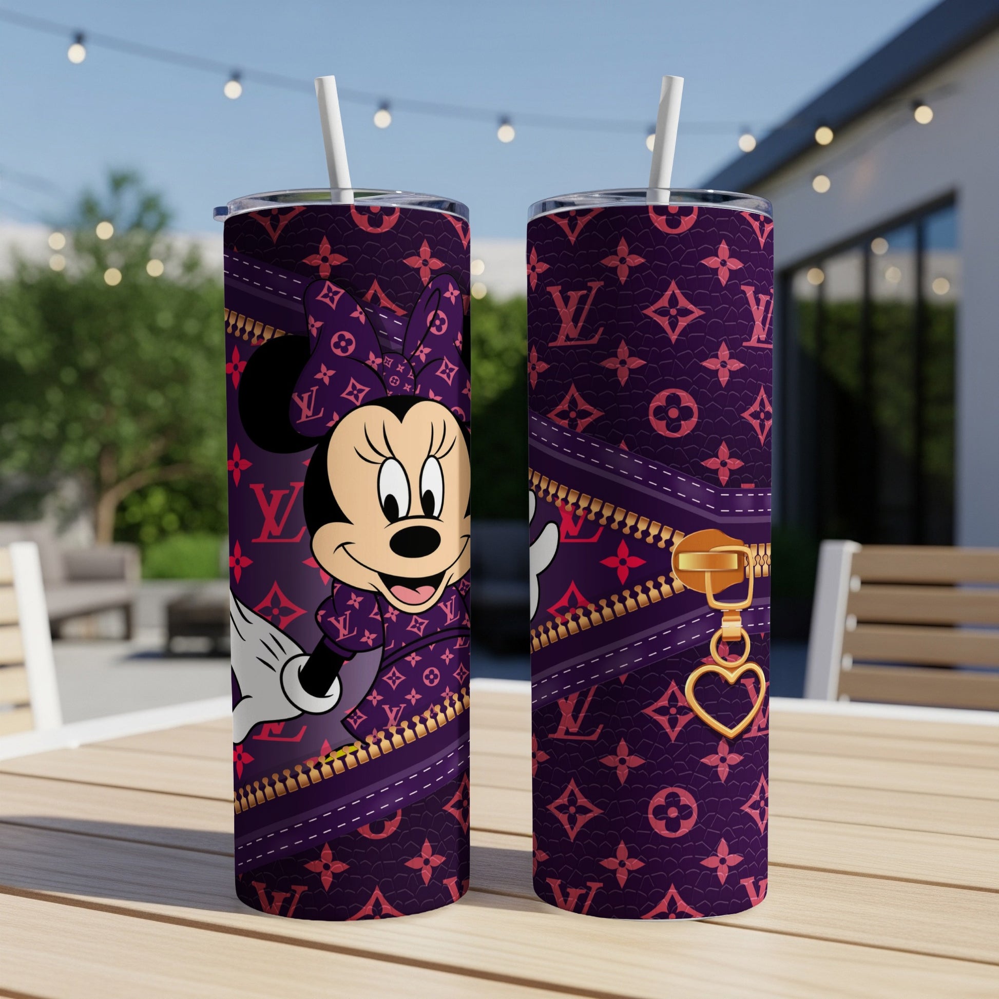 Minnie Mouse on a purple tumbler with gold zipper and heart charm.