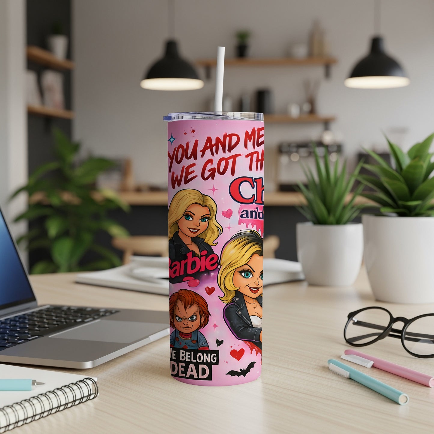 Pink tumbler with Barbie and Chucky cartoon characters and text.