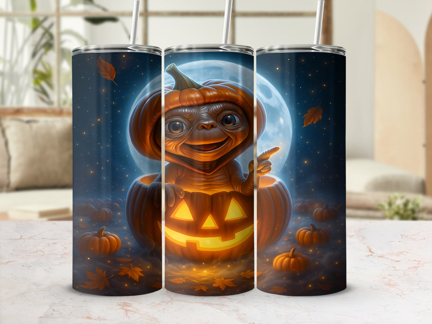 ET character wearing a pumpkin hat sits inside a jack-o'-lantern with a moonlit sky.