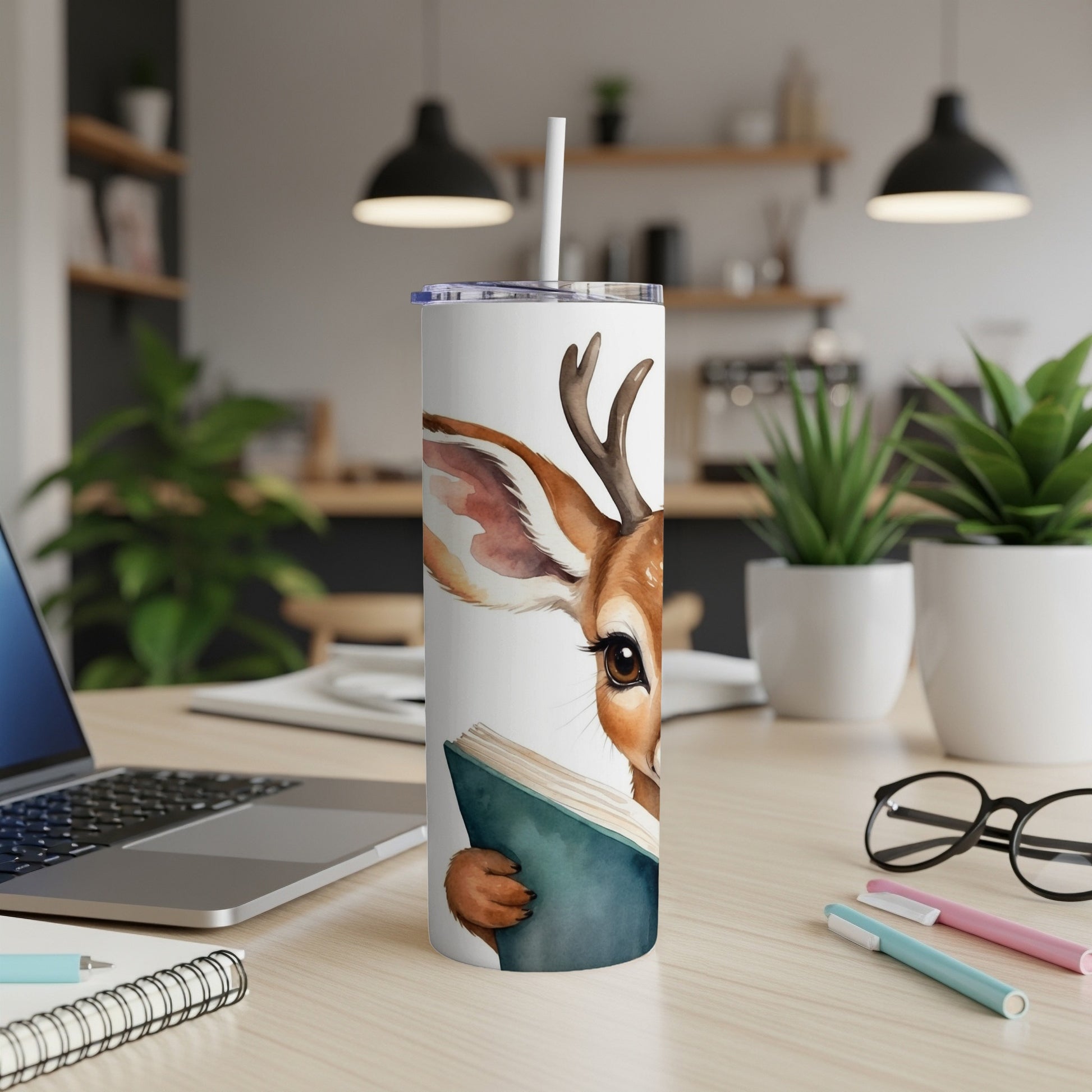 Deer character holding an open book, peeking over it, on a desk.