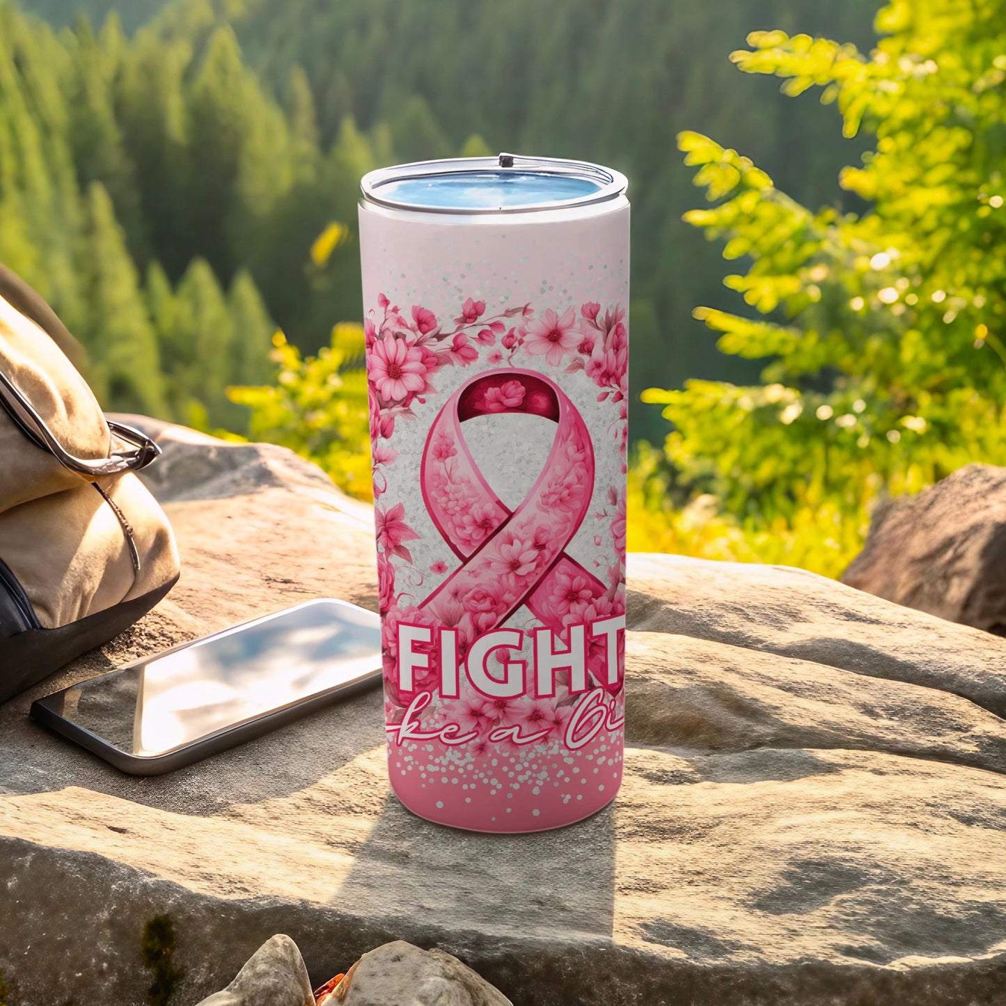 Pink tumbler with floral and ribbon design, text reads "Fight Like a Girl".