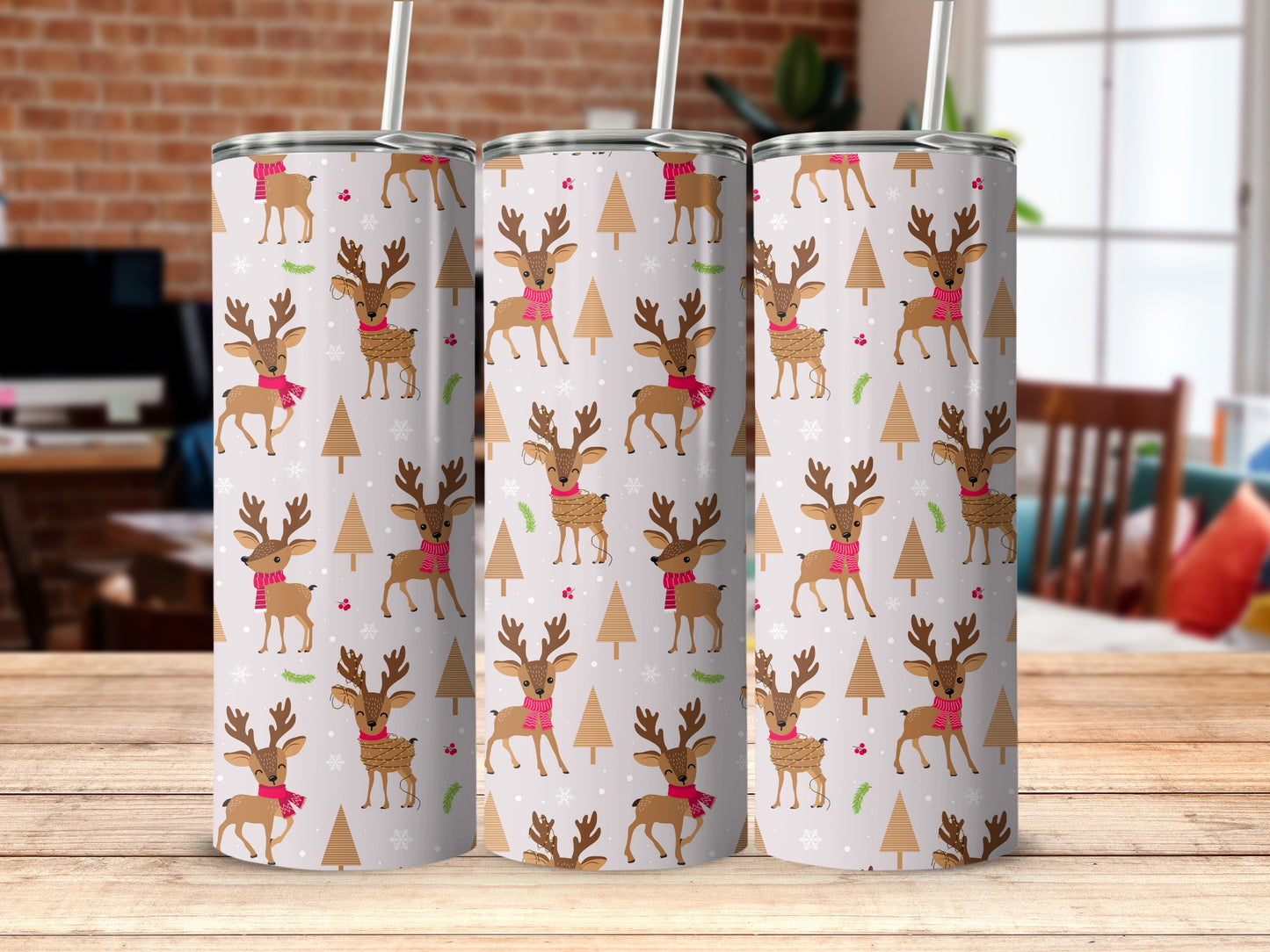 Tumbler with festive reindeer, Christmas trees, and snowflakes pattern.