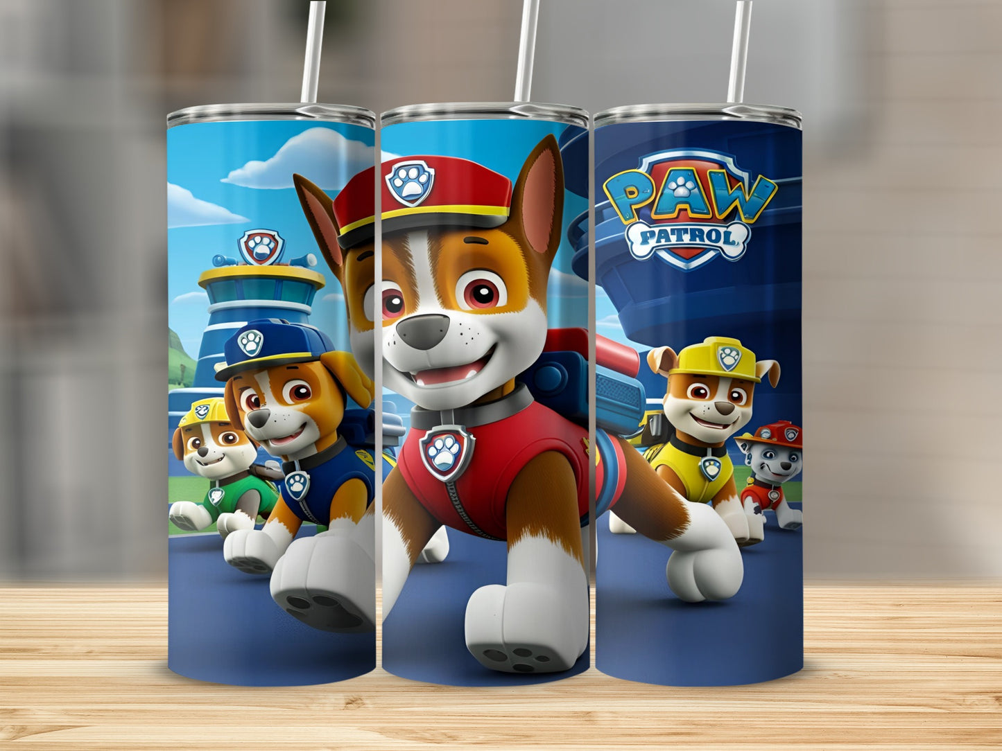 Paw Patrol characters Chase, Marshall, and Ryder on a blue tumbler.