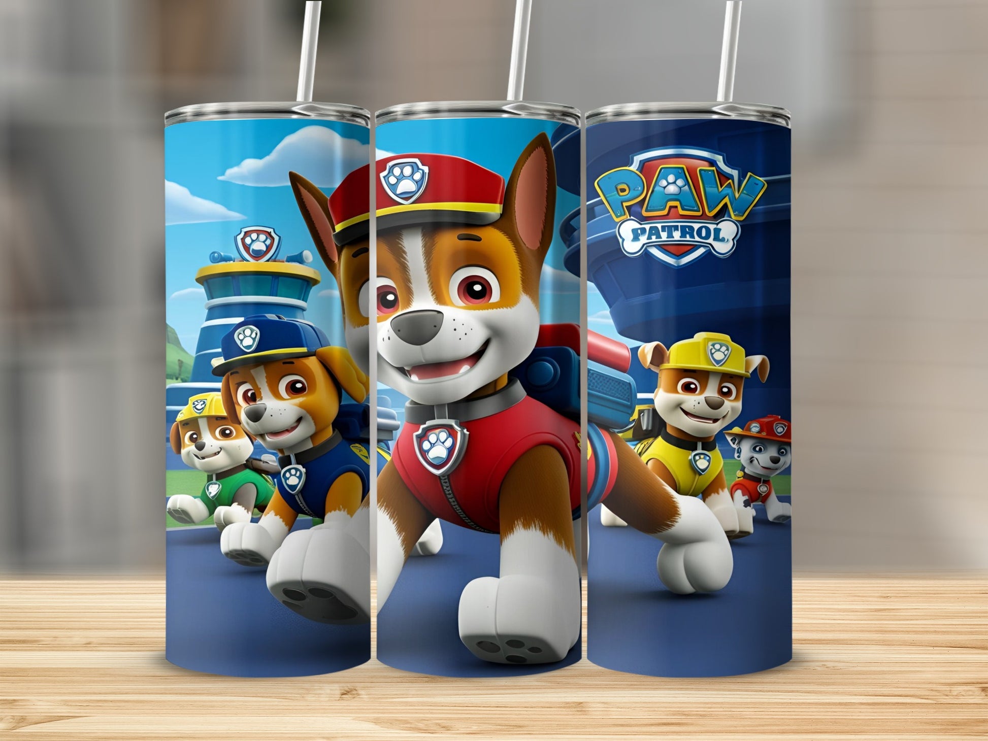 Paw Patrol characters Chase, Marshall, and Ryder on a blue tumbler.