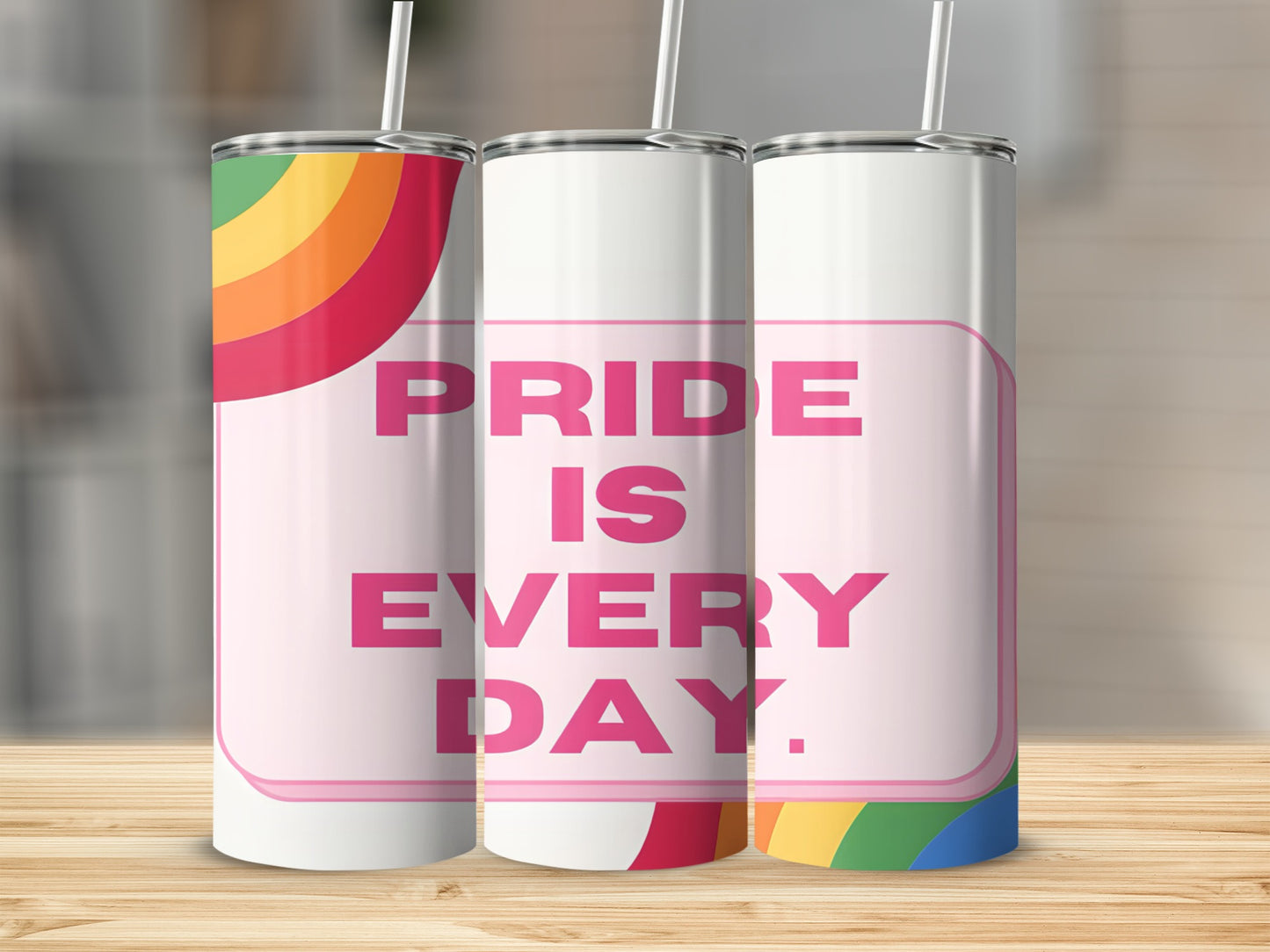 Pride is Every Day text on a rainbow-striped tumbler.