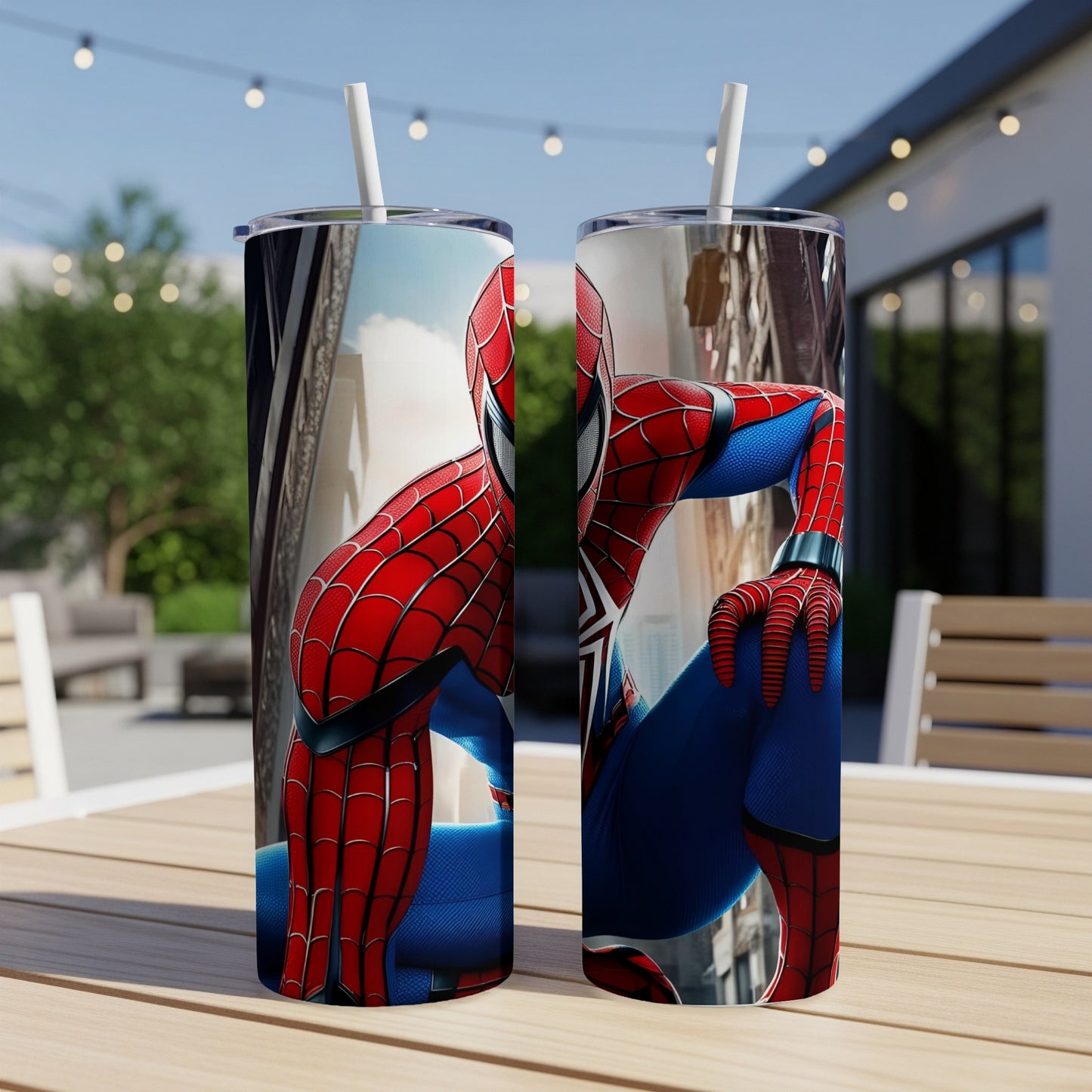 Spiderman tumbler with a cityscape background on an outdoor table.