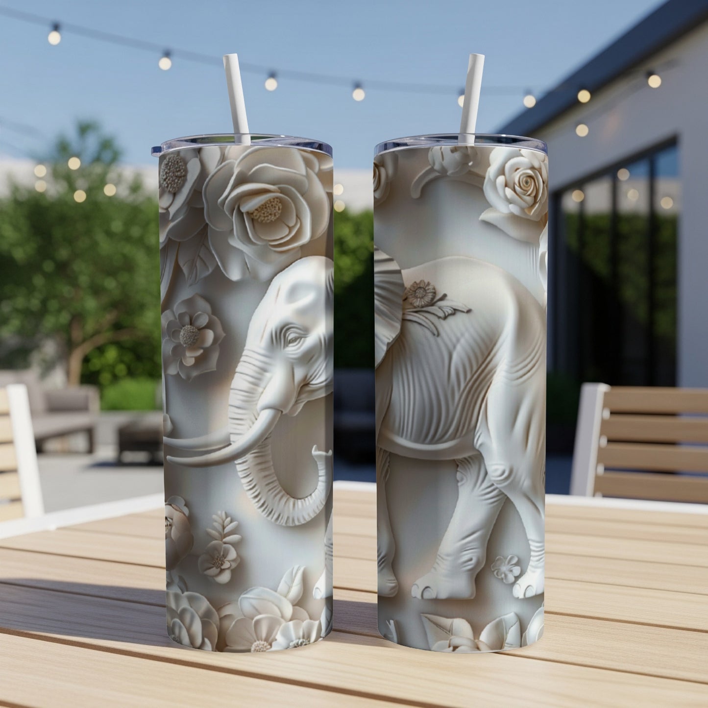 White embossed elephant and floral design on two tumblers with straws.