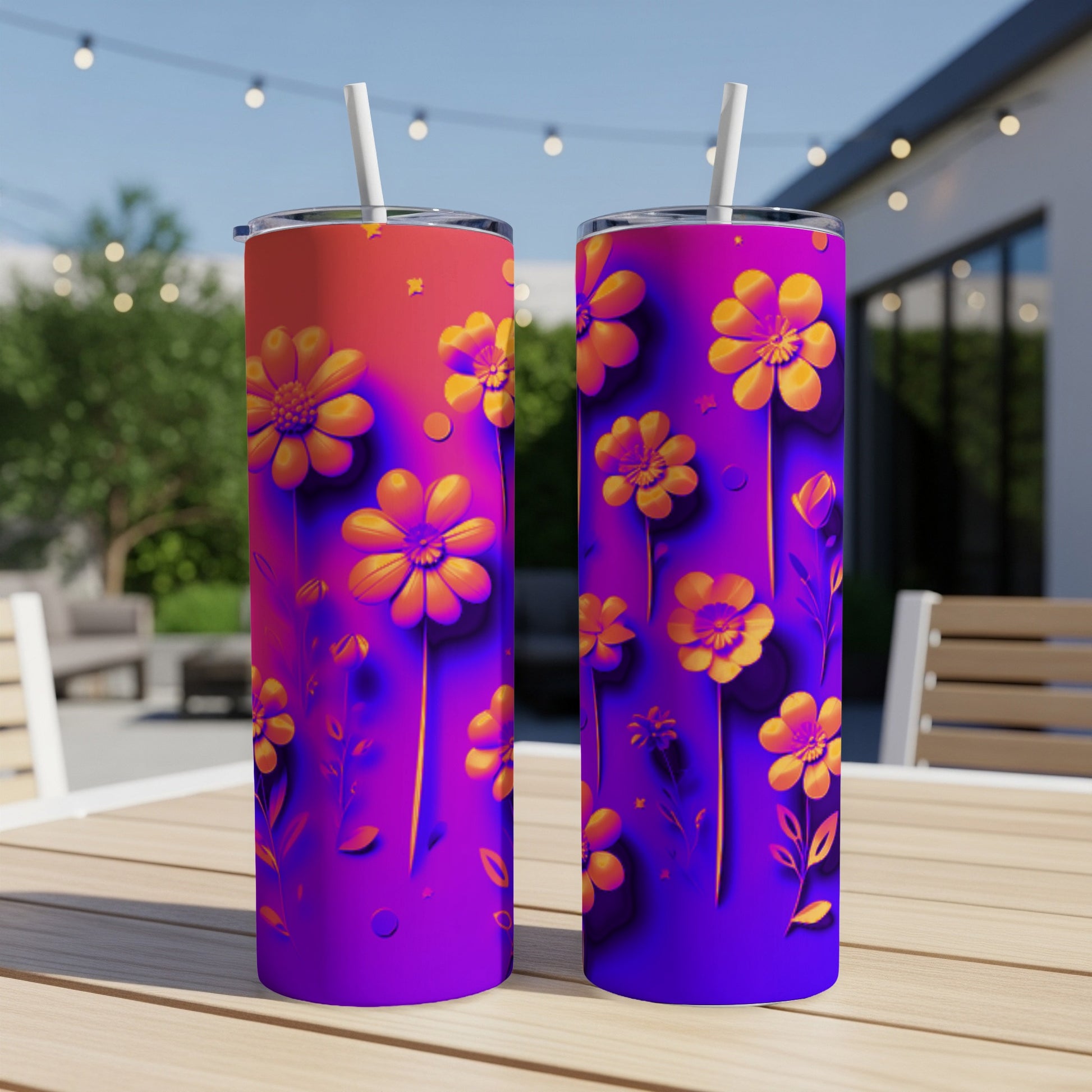 Two tumblers with a vibrant floral design featuring orange and yellow flowers on a purple and orange background.