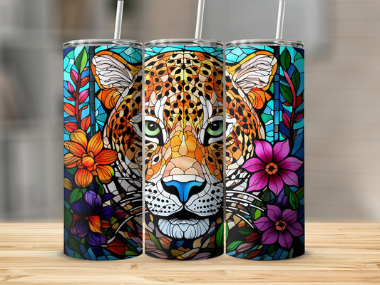 Stained glass leopard face and flowers on three tumblers.