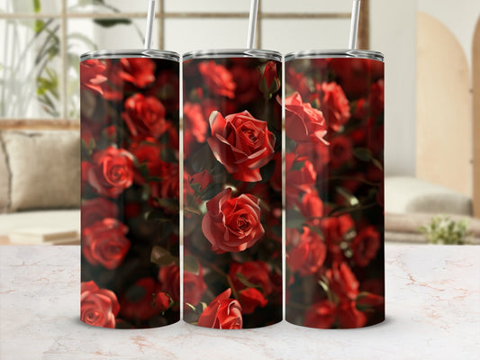 Three tumblers with red roses pattern, displayed on a marble surface.