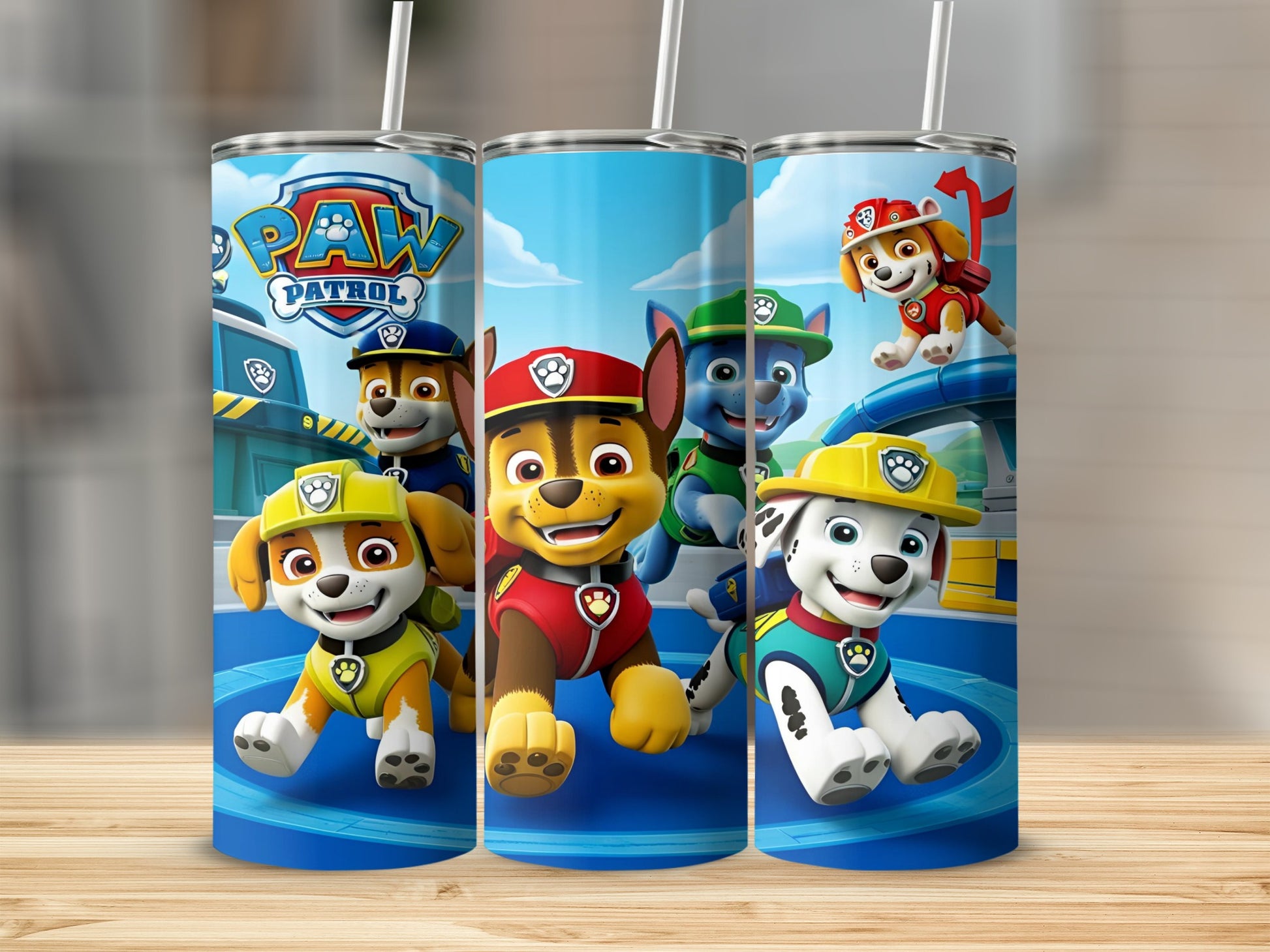 Paw Patrol pups Chase, Marshall, Rubble, Rocky, and Zuma on a blue background.
