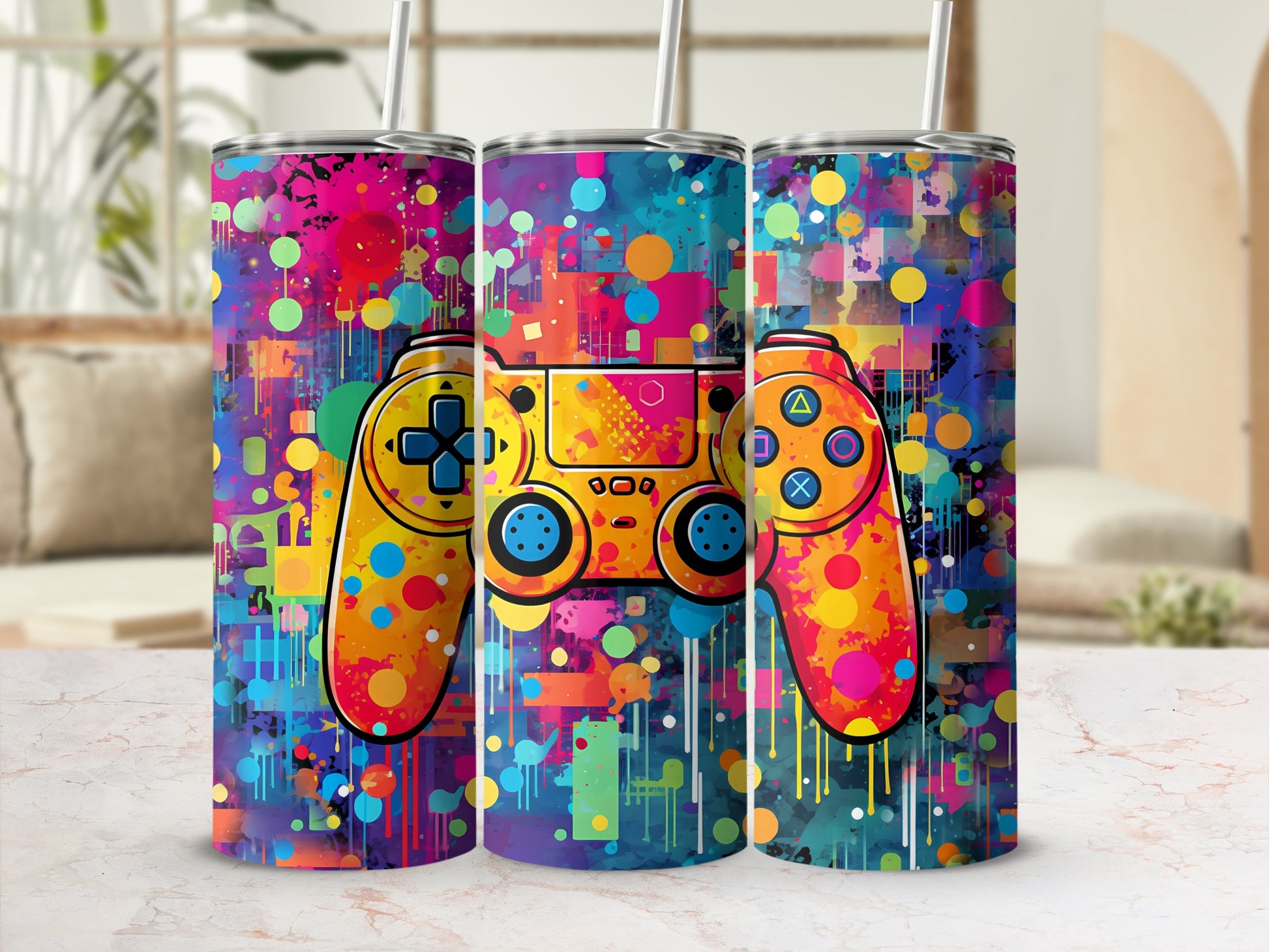Three tumblers featuring a colorful abstract video game controller design.