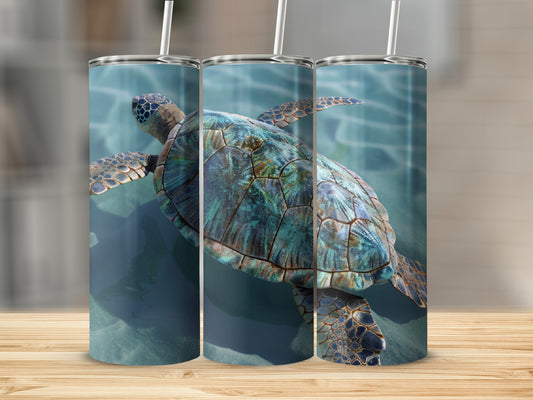 Three tumblers with a sea turtle design displayed on a wooden surface.